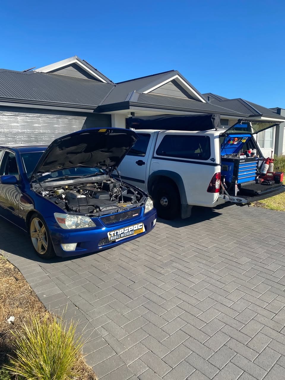 TopSpec mobile mechanic servicing a car at a customer's home